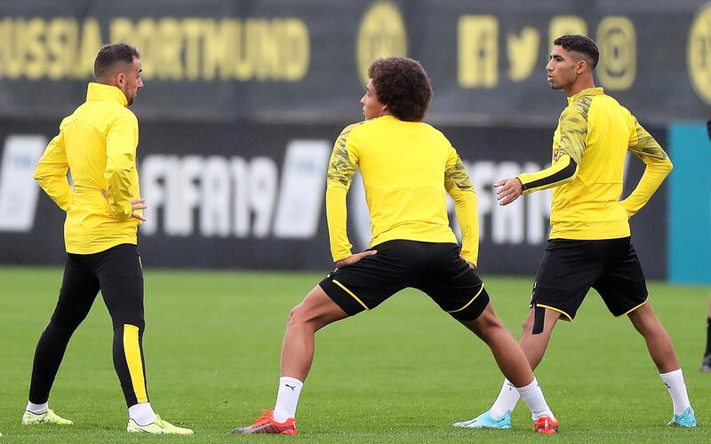 Dortmund players doing stretching exercises. EPA