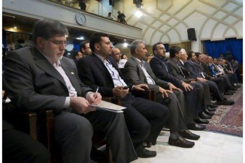 Ali Akbar Javanfekr, left, an adviser to Iran's president, attends a conference given by Mahmoud Ahmadinejad in Tehran in June.