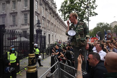 Laurence Fox, Reclaim party leader speaks during an anti-Vaccine and anti-lockdown demonstration outside Downing street in central London, on June 26, 2021.  / AFP / DANIEL LEAL-OLIVAS
