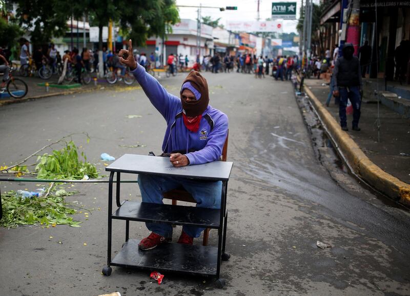 A demonstrator blocks a street during a protest against Nicaragua's President Daniel Ortega's government in Masaya, Nicaragua. Oswaldo Rivas / Reuters