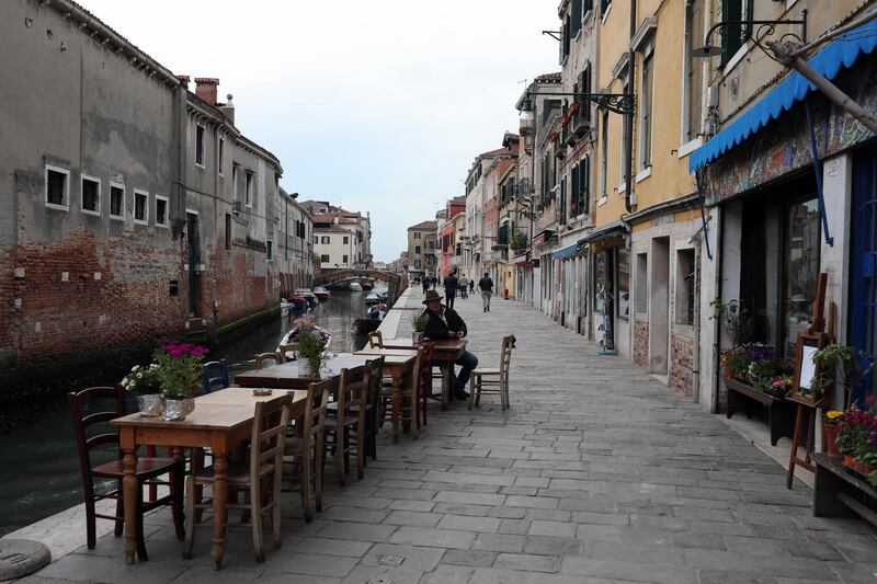 A Venetian sits outside the historical cafe called 'The lost Paradise' at the fondamenta della Misericordia in Venice, Italy. Getty Images