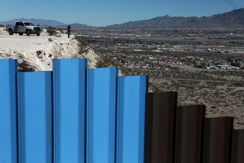 The Mexico-US border fence, on the Mexican side, separating the towns of Anapra, Mexico and Sunland Park, New Mexico. AP