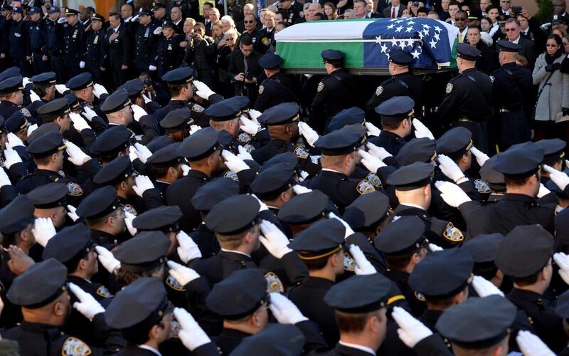 Police officers carry the coffin of New York City police officer Rafael Ramos following his funeral at Christ Tabernacle Church in Glendale, New York, on 27 December, 2014. Justin Lane/EPA