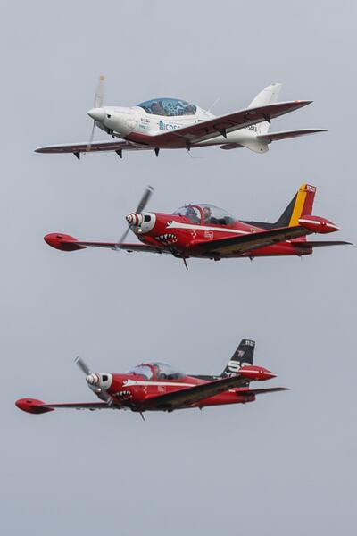 Zara Rutherford's small plane is escorted by two other aircraft as she approached her final landing. EPA