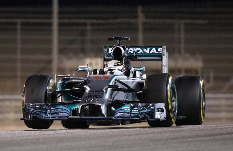 Mercedes driver Lewis Hamilton of Britain drives during the Formula One Bahrain Grand Prix at Sakhir circuit in Manama on April 6, 2014. Teammate Nico Rosberg took pole position but finished second to Hamilton ensuring a Mercedes lockout for the second straight race. AFP PHOTO / MARWAN NAAMANI

