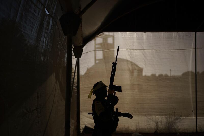 A Fatah militant hold his rifle during a rally in Khan Younis, southern Gaza Strip. AP