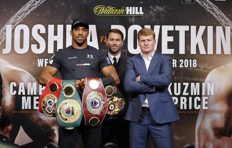 Britain's Anthony Joshua (L) poses by his challenger Russia's Alexander Povetkin during a joint press conference at Wembley stadium in London on September 20, 2018 ahead of the title defence boxing match on Saturday. / AFP / Tolga AKMEN
