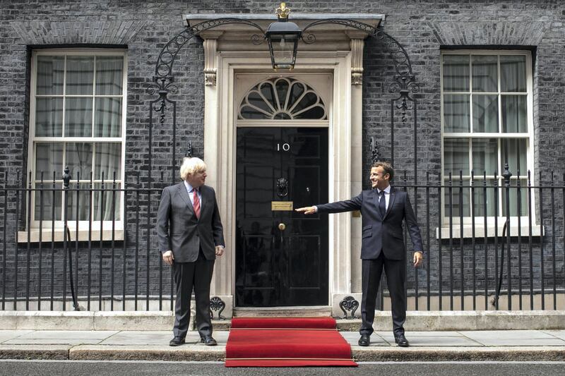 LONDON, ENGLAND - JUNE 18: Prime Minister, Boris Johnson greets French President, Emmanuel Macron while keeping at a social distance at Number 10 Downing Street on June 18, 2020 in London, England. L'Appel du 18 Juin (The Appeal of 18 June) was the speech made by Charles de Gaulle to the French in 1940 and broadcast in London by the BBC. It called for the Free French Forces to fight against German occupation. The appeal is often considered to be the origin of the French Resistance in World War II. President Macron is the first foreign dignitary to visit the UK since the Coronavirus Lockdown began. (Photo by Dan Kitwood/Getty Images)