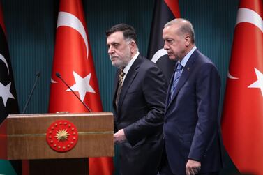 Turkish President Recep Tayyip Erdogan, right, and Libyan Prime Minister Fayez Al Sarraj arrive for a joint press conference in Ankara this week. AFP