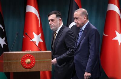 Turkish President Recep Tayyip Erdogan (R) and Libyan Prime Minister Fayez al-Sarraj (L) arrive for a joint press conference at the Presidential Complex in Ankara on June 4, 2020.   / AFP / Adem ALTAN

