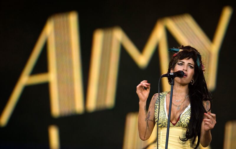 FILE - In this July 4, 2008 file photo, singer Amy Winehouse of England performs during the Rock in Rio music festival in Arganda del Rey, on the outskirts of Madrid. British police say singer Amy Winehouse has been found dead at her home in London on Saturday, July 23, 2011. The singer was 27 years old. (AP Photo/Victor R. Caivano, File) *** Local Caption ***  Britain Obit Amy Winehouse.JPEG-00636.jpg