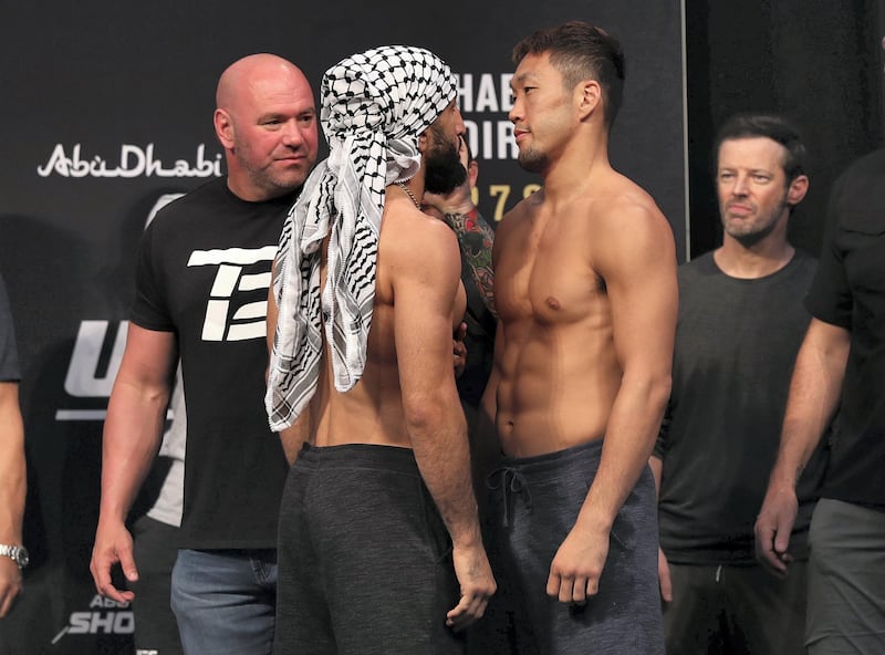 Abu Dhabi, United Arab Emirates - September 06, 2019: Belal Muhammad (L) and Takashi Satō square off at UFC 242. Friday the 6th of September 2019. Yes Island, Abu Dhabi. Chris Whiteoak / The National