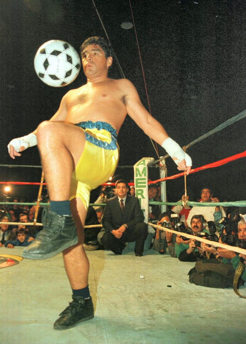 3 Apr 1996:  Soccer star Diego Maradona juggles a soccer ball in the ring at the end of a charity boxing match against Falucho Lacier, former WBA Flyweight world champion at the General Paz Junior's Club in Cordoba, Argentina.  The match, for which proceeds went to the club's soccer team, went the scheduled three rounds and was called a draw. Mandatory Credit: Ben Radford/ALLSPORT