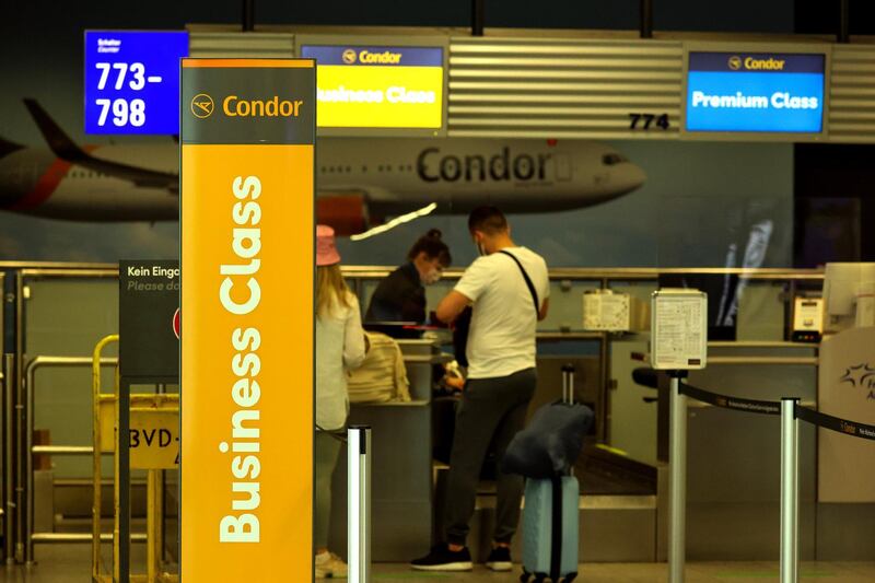 Travelers at the Condor Flugdienst GmbH business class check-in area at Frankfurt Airport in Frankfurt, Germany, on Tuesday, June 8, 2021. Ryanair will tomorrow appeal the European Commission's decision in April 2020 to approve Covid-19-related aid in the form of a 550 million-euro German State-guaranteed loan to charter airline Condor. Photographer: Alex Kraus/Bloomberg