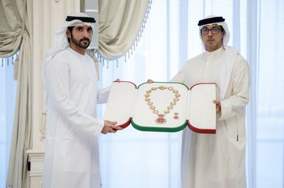 Sheikh Hamdan receives the award from Sheikh Mansour bin Zayed. Photo: Presidential Court Abu Dhabi