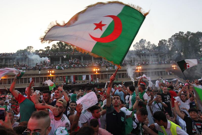 Algerian fans celebrate the triumph in Algiers. AFP