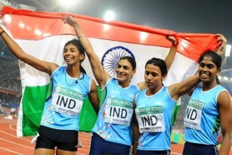 India's Sini Jose, Ashwini Akkunji, Manjeet Kaur and Mandeep Kaur celebrate their win in the women's 4x400m relay final at the Commonwealth Games in 2010. William West / AFP