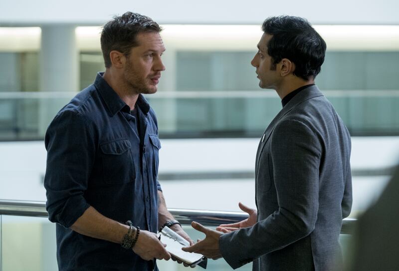This image released by Sony Pictures shows Tom Hardy, left, and Riz Ahmed in a scene from "Venom." (Frank Masi/Sony Pictures via AP)