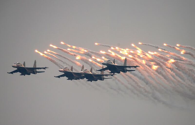 Vietnamese fighter jets put on a pyrotechnic display before the country's International Defence Exhibition from December 8 to 10.  EPA 