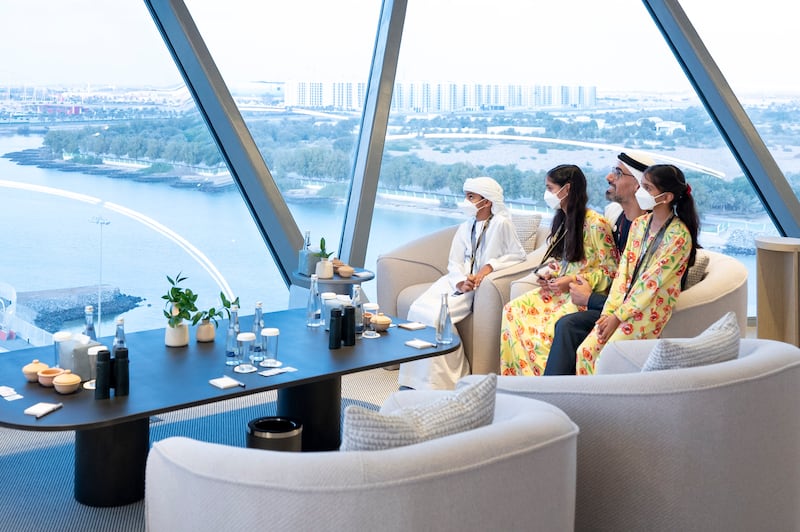 Sheikh Khaled bin Mohamed, member of Abu Dhabi Executive Council and Chairman of Abu Dhabi Executive Office, Sheikha Salama bint Khaled, Sheikha Shamma bint Khaled and  Sheikh Mohamed bin Khaled watch the grand prix from Shams Tower. Photo:  Abdullah Al Neyadi / Ministry of Presidential Affairs