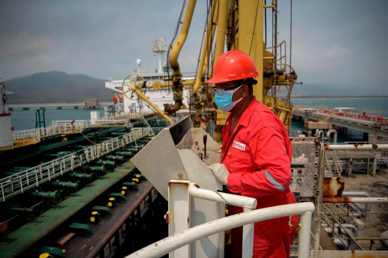 A worker of the Venezuelan state oil company PDVSA looks at the oil tanker Fortune as it docks at the El Palito refinery in Puerto Cabello in the northern state of Carabobo, Venezuela.  AFP