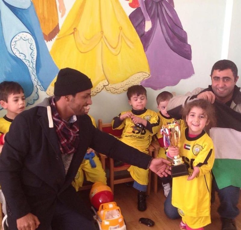 Salem Alkarbi hosts events for disadvantaged children worldwide through his football charity "Beyond the Boundaries of Football". Here he is in Armenia. Courtesy Salem Alkarbi