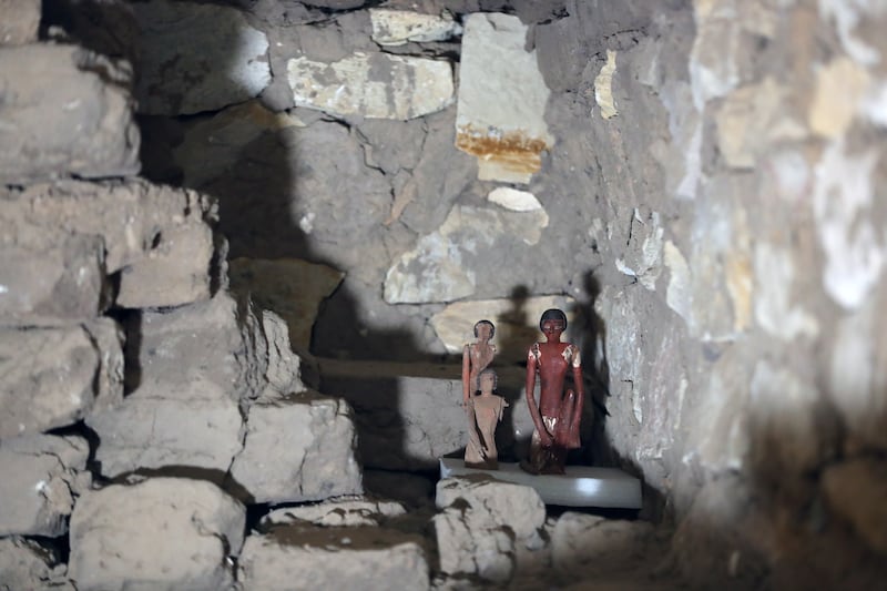Figurines stand inside the tomb of a man named Henu. EPA