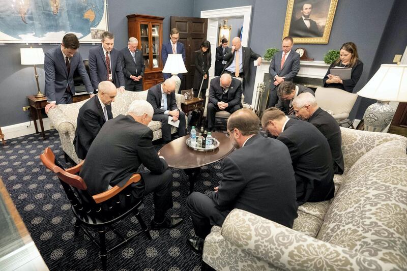 Mike Pence prays with the coronavirus task force. Critics noted that prayer would not stop the virus and the only effective defence strategy requires scientific and medical expertise.