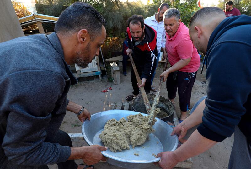 Libyans cook traditional bread as they prepare to break their fast in Tajoura, east of the capital Tripoli. AFP