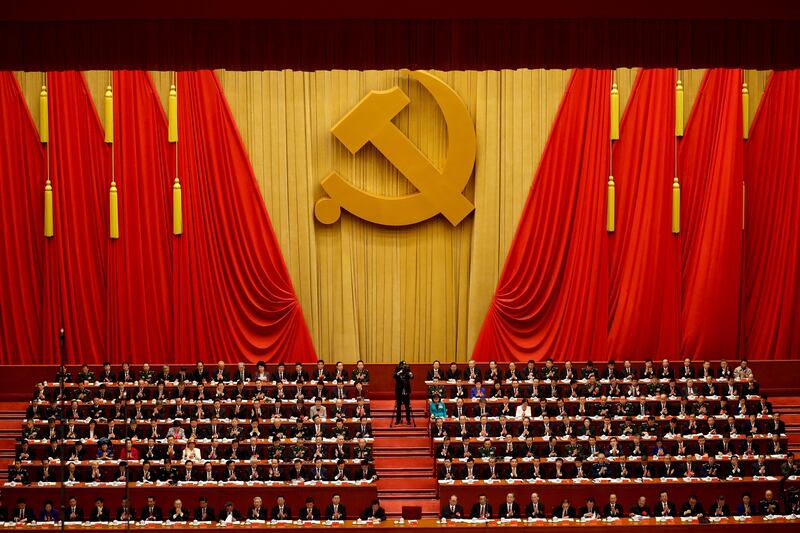 Communist Party's top delegates applaud Chinese president Xi Jinping. Andy Wong / AP Photo