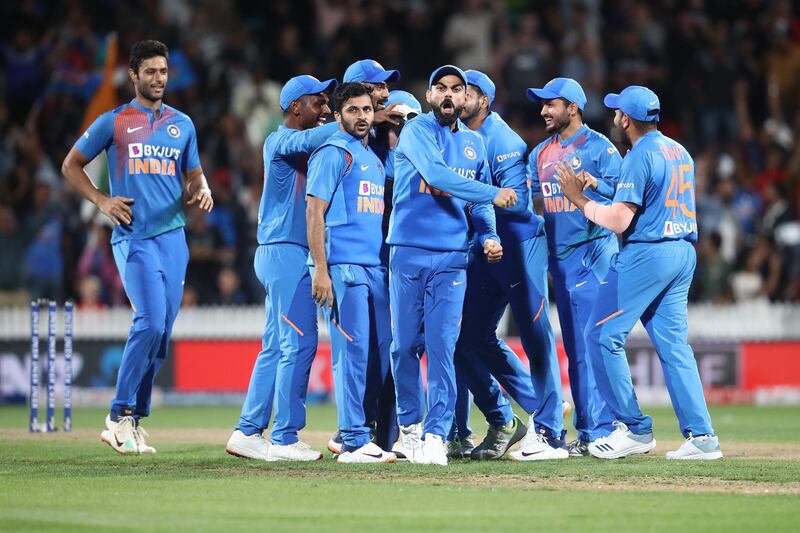 Virat Kohli celebrates the wicket of Ross Taylor of New Zealand that sent the Hamilton T20 into super over at Seddon Park on Wednesday. Getty Images