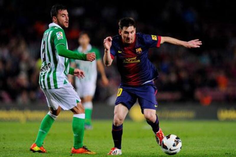 Lionel Messi, right, took just three minutes to score against Real Betis. David Ramos / Getty Images