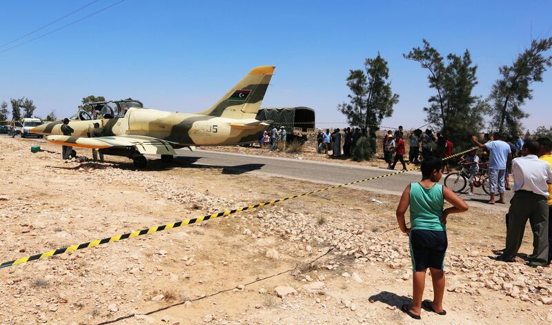 A warplane belonging to eastern Libyan forces fighting the internationally recognized Tripoli government is seen after an emergency landing on a road in the southern Tunisian town of Beni Khadash. Reuters