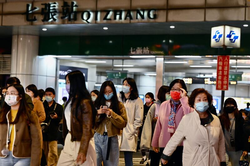 Commuters exit a metro station in Taipei, in January, after a strong earthquake struck off the coast of eastern Taiwan. AFP
