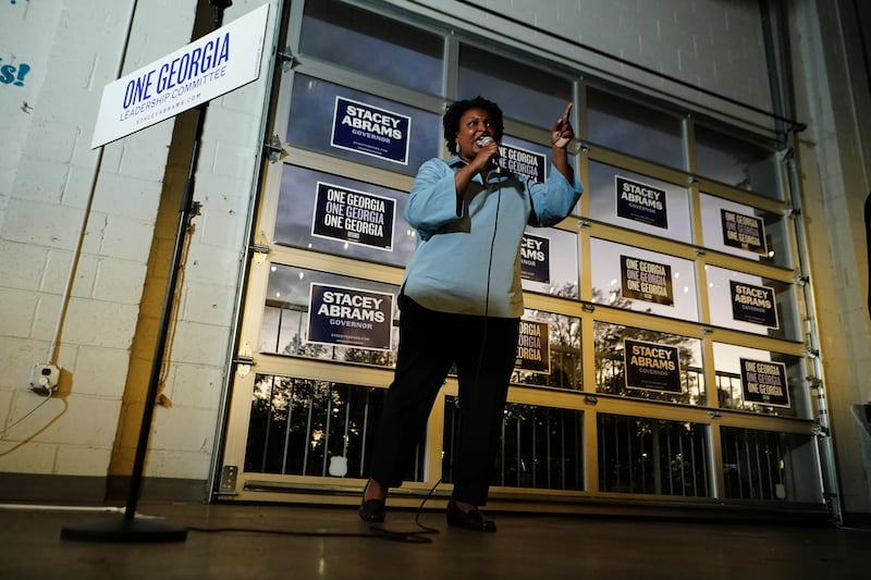 Democratic candidate for Georgia governor Stacey Abrams speaks to volunteers during an election eve phone and text bank party in Atlanta. AP 