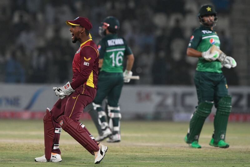 West Indies captain and wicketkeeper Nicholas Pooran celebrates after the dismissal of Pakistan's Mohammad Rizwan during the first ODI in Multan on Wednesday, June 8, 2022. AFP