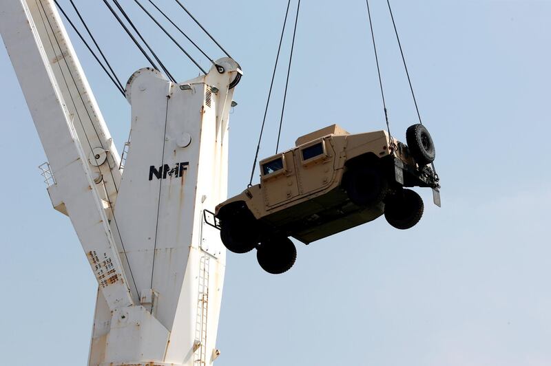 Workers unload a Humvee, part of a military donation from the U.S. government to the Lebanese army, during a ceremony at Beirut's port, Lebanon, August 9, 2016. REUTERS/Mohamed Azakir