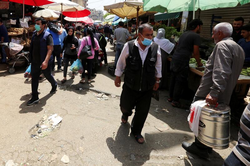 People shop at a crowded souk as Lebanon's government ordered most of the country to shut down again for four days, starting on Wednesday night, to ward off a coronavirus disease (COVID-19) resurgence after easing some restrictions, in Sabra, Beirut suburbs, Lebanon May 13, 2020. REUTERS/Aziz Taher