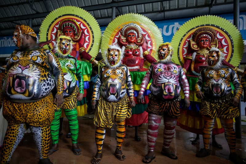 Pulikali or tiger dance artists before the Athachamayam procession in Kochi. AP