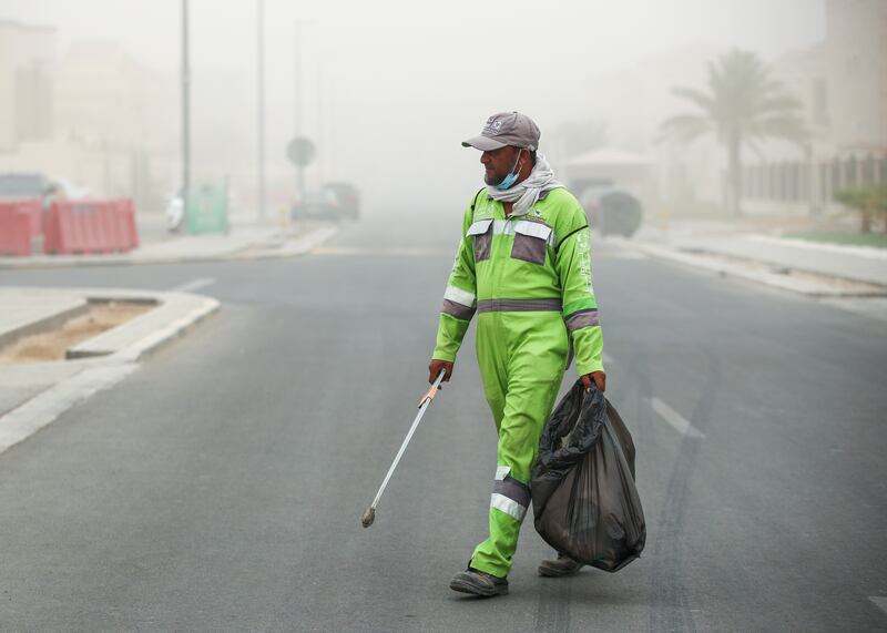 Workers making an early start on Sunday in Khalifa City, Abu Dhabi, were greeted by dusty weather.  

