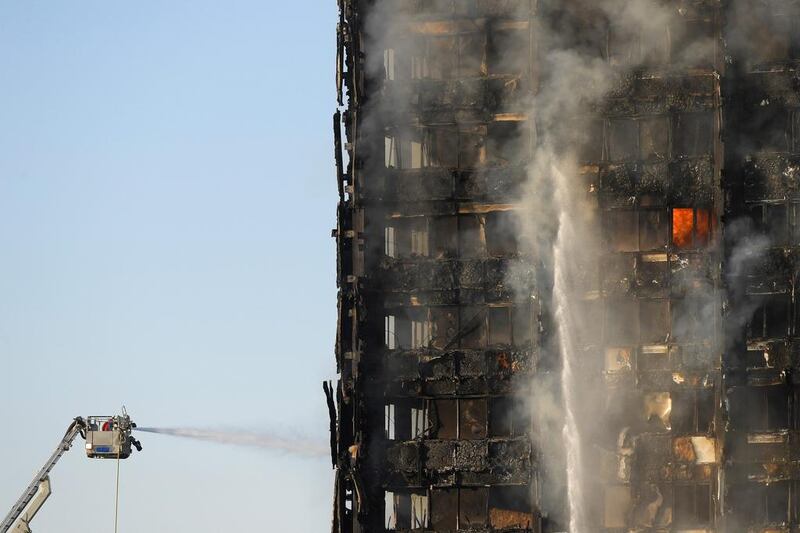 Firefighters tackle the fire in Latimer Road in West London. Toby Melville / Reuters