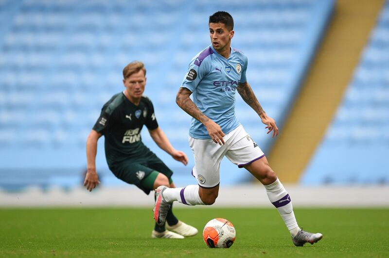 Joao Cancelo - 7: Came in field looking to get on the ball. Surprised to see him replaced at half time. AFP