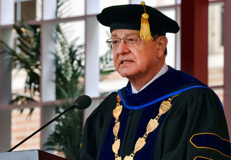In this May 12, 2017 photo University of Southern California, USC President C.L. Max Nikias presides at commencement ceremonies on the campus in Los Angeles. Nikias has agreed to step down amid a sex scandal involving a school gynecologist. A letter to faculty members on Friday, May 25, 2018, that was obtained by The Associated Press, said the school's board of trustees had "agreed to begin an orderly transition" and begin searching for a new president. The letter did not say when Nikias would leave his post. (AP Photo/Richard Vogel)2