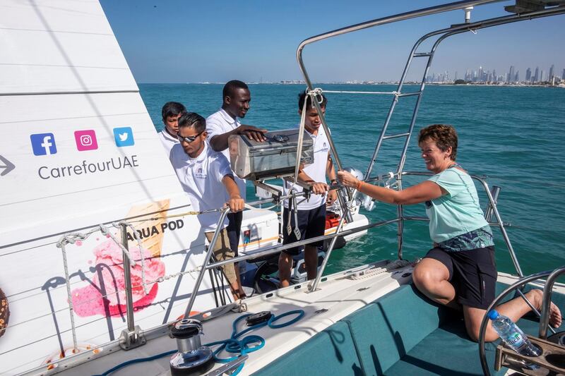 DUBAI, UNITED ARAB EMIRATES. 12 DECEMBER 2018. Trying out the new floating Carrefour mini market off the coast of Dubai. Dubai resident Marie Byrne takes her yacht out to try the new Carrefour floating shop. Maria comes alongside the floating shop, orders items and pays for them. (Photo: Antonie Robertson/The National) Journalist: Nicke Webster. Section: National.