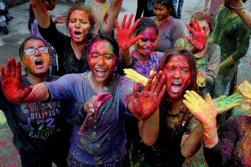 Holi celebrates both the New Year in the Hindu calendar and the start of spring and the new harvest. EPA