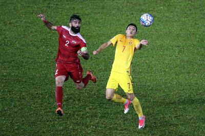 MALACCA, MALAYSIA - JUNE 13:  Wu Lei of China battles with Ahmad Al Saleh of Syria during the 2018 FIFA World Cup Asian Qualifier Group A Final Round match between Syria and China at Hang Jebat Stadium on June 13, 2017 in Malacca, Malaysia.  (Photo by Stanley Chou/Getty Images)