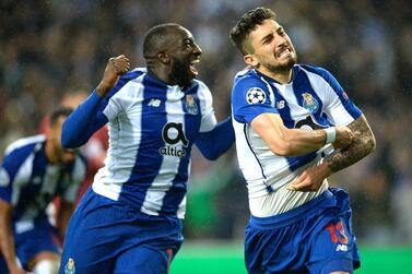 epa07418381 FC Porto's Alex Telles (R) and Moussa Marega celebrates a goal against Roma during their Champions League last-16 second leg soccer match, held at Dragao stadium, Porto, Portugal, 06 March 2019. EPA/FERNANDO VELUDO