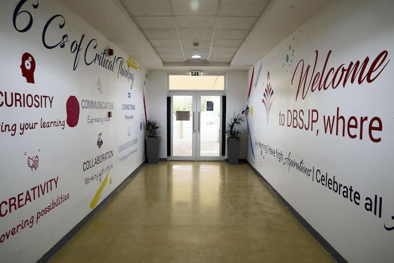 DUBAI, UNITED ARAB EMIRATES , August 9 – 2020 :- View of one of the entrance at the Dubai British School in Jumeirah Park in Dubai. New Covid safety setup in different areas of the school such as 1.5 meter distance on the table in the class room, hand sanitizer, safety message, social distancing stickers pasted on the floor, thermal cameras will be installed at the entrance of the school. School will open on 30th August. (Pawan Singh / The National) For News/Online/Instagram. Story by Kelly