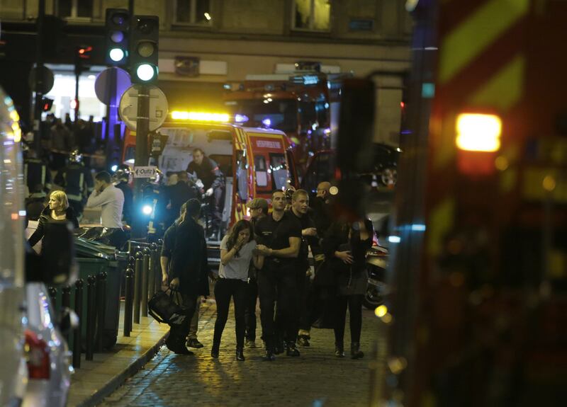 French security moving people in the area of Rue Bichat in the 10th arrondissement of the French capital Paris following a string of attacks on November 13, 2015. At least 18 people were killed as multiple shootings and explosions hit Paris, police said. Police also said there was an ongoing hostage crisis in the Bataclan a concert hall in the French capital.Kenzo Tribouillard/AFP Photo
