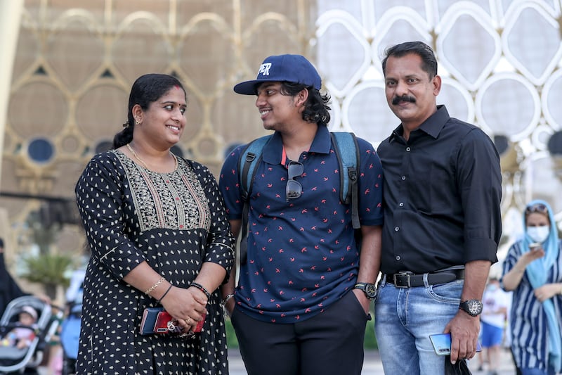 Family members Sridevi, left, Sreeram, centre, and Santosh Kumar visit the Expo for the first time.